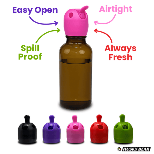 Brown bottle with pink cap and colorful caps below, labeled for features on a white background.